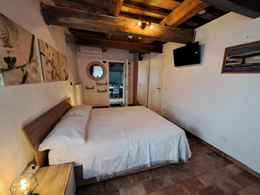 Postel nebo postele na pokoji v ubytování B&B Ca Rossa
