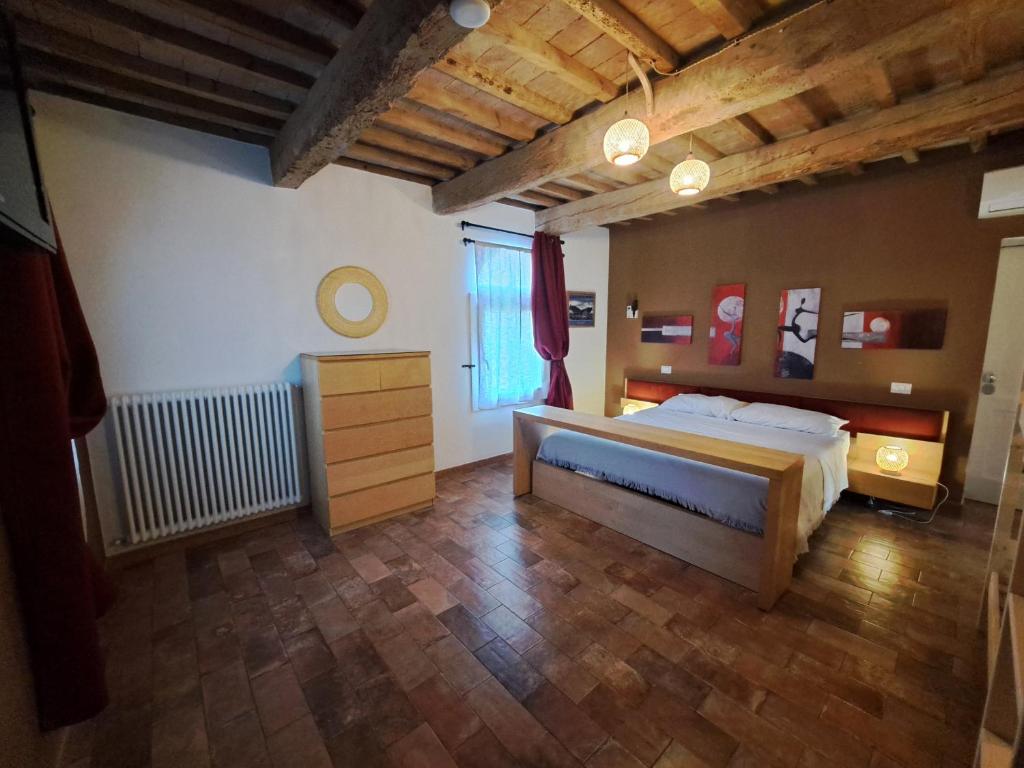 Postel nebo postele na pokoji v ubytování B&B Ca Rossa