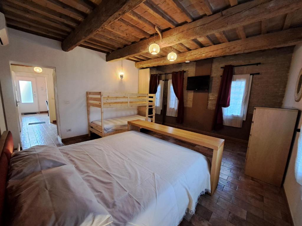 Postel nebo postele na pokoji v ubytování B&B Ca Rossa