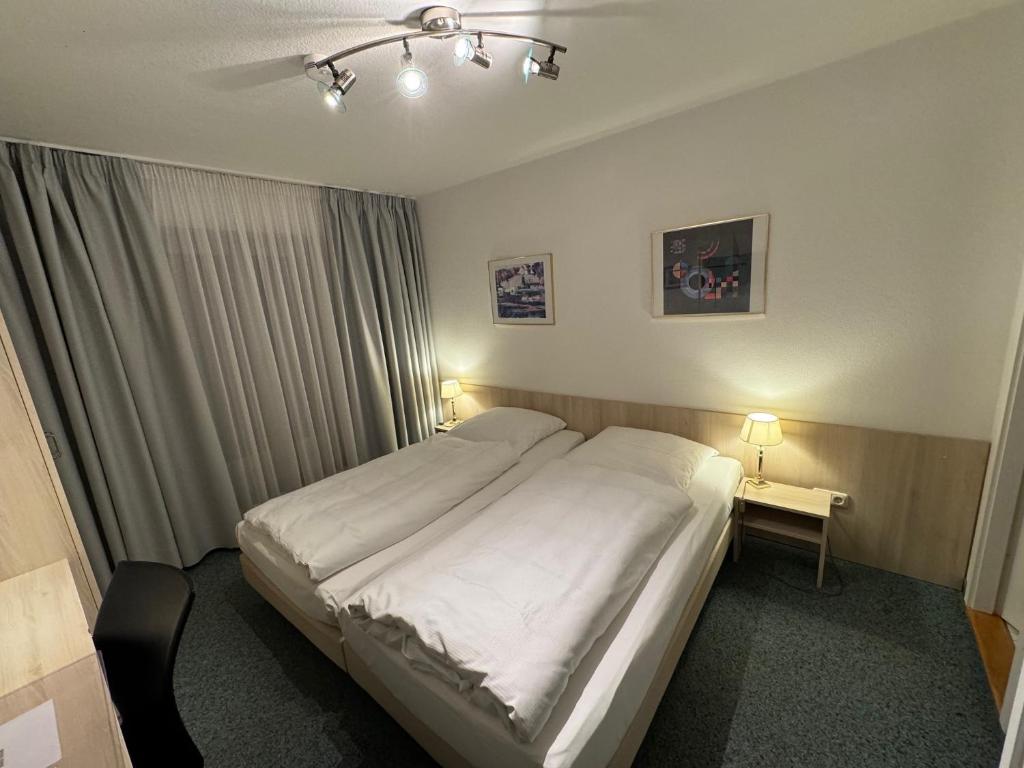 Postel nebo postele na pokoji v ubytování Hotel Occam