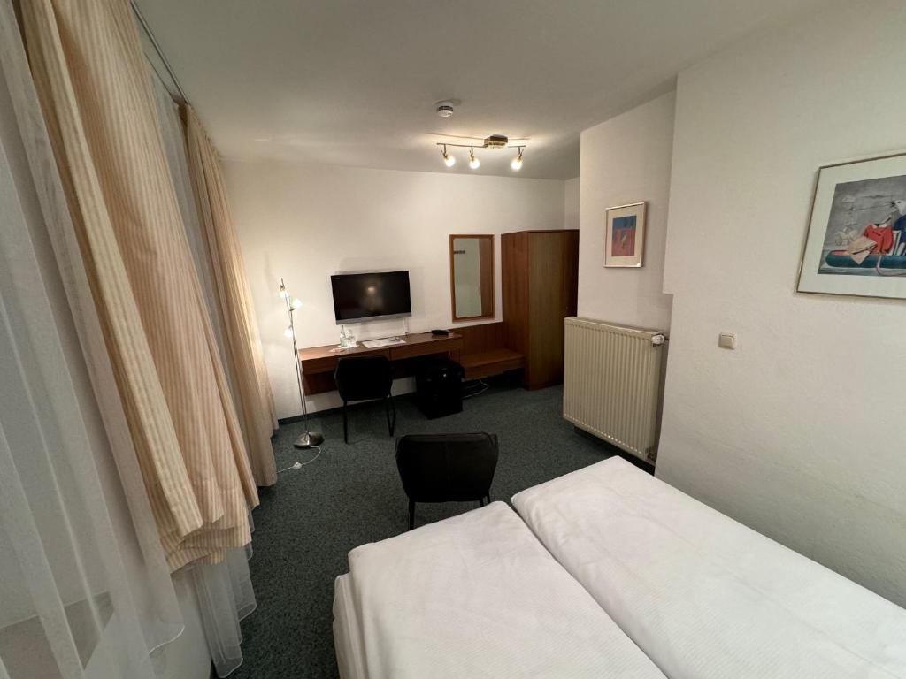 Postel nebo postele na pokoji v ubytování Hotel Occam