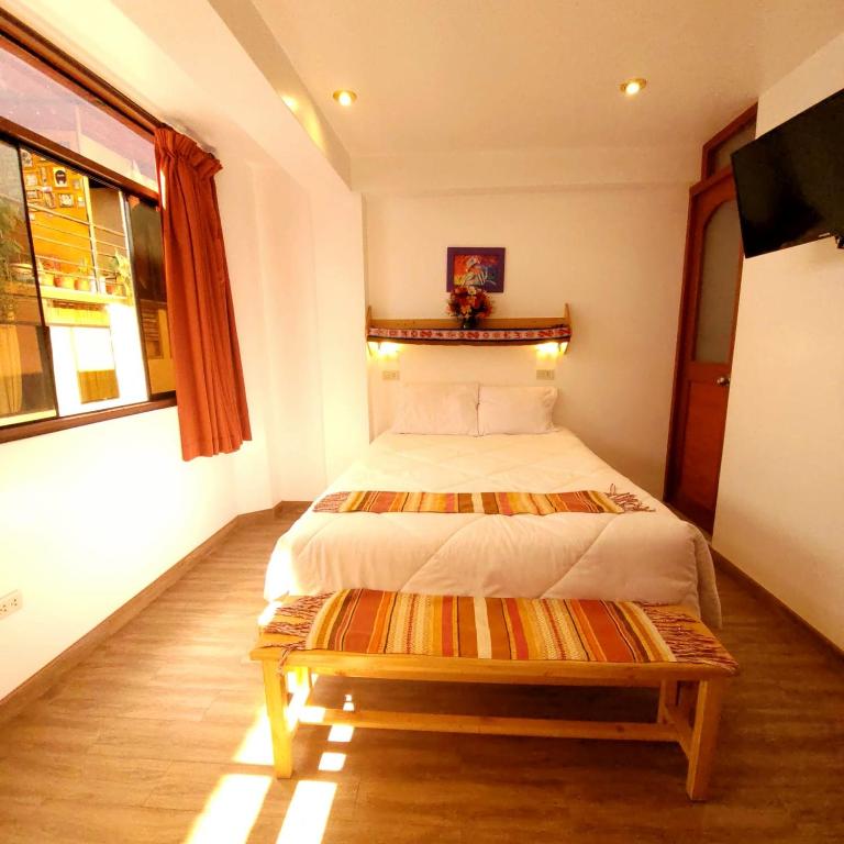 Postel nebo postele na pokoji v ubytování Hotel Ruta Amazónica Machupicchu