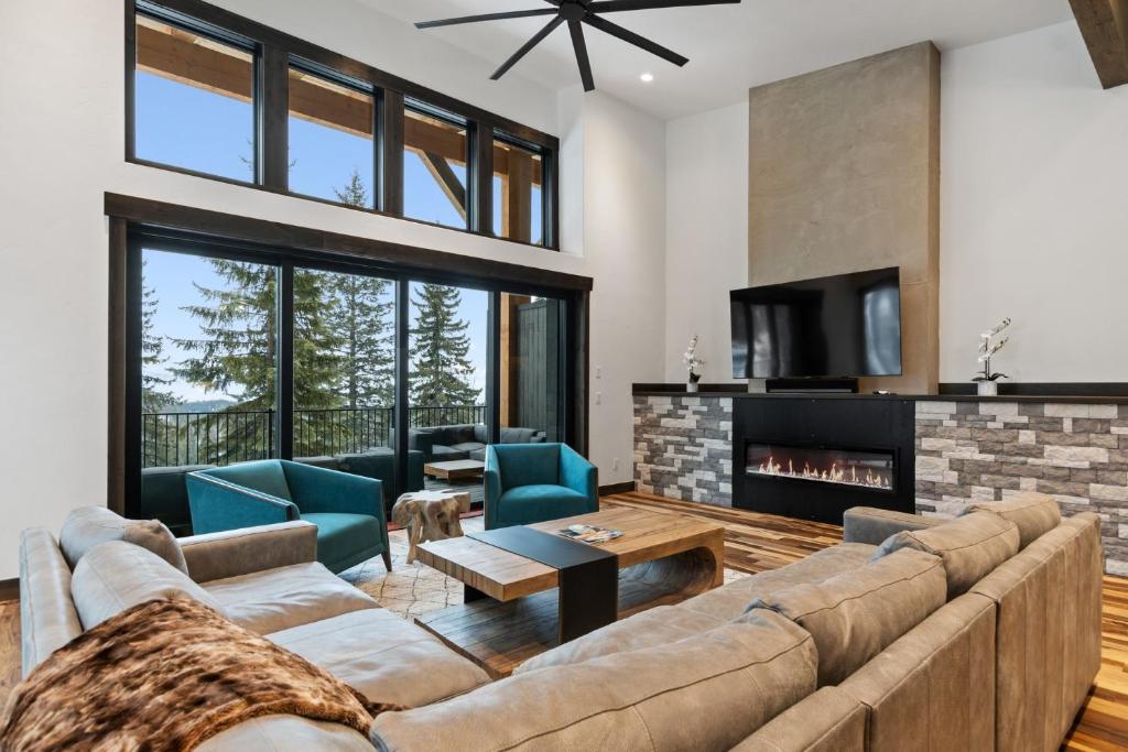 a living room with a couch and a fireplace at Latitude Adjustment in Whitefish