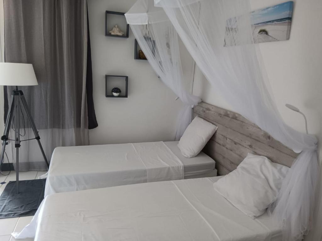 Postel nebo postele na pokoji v ubytování Tropic Bellevue