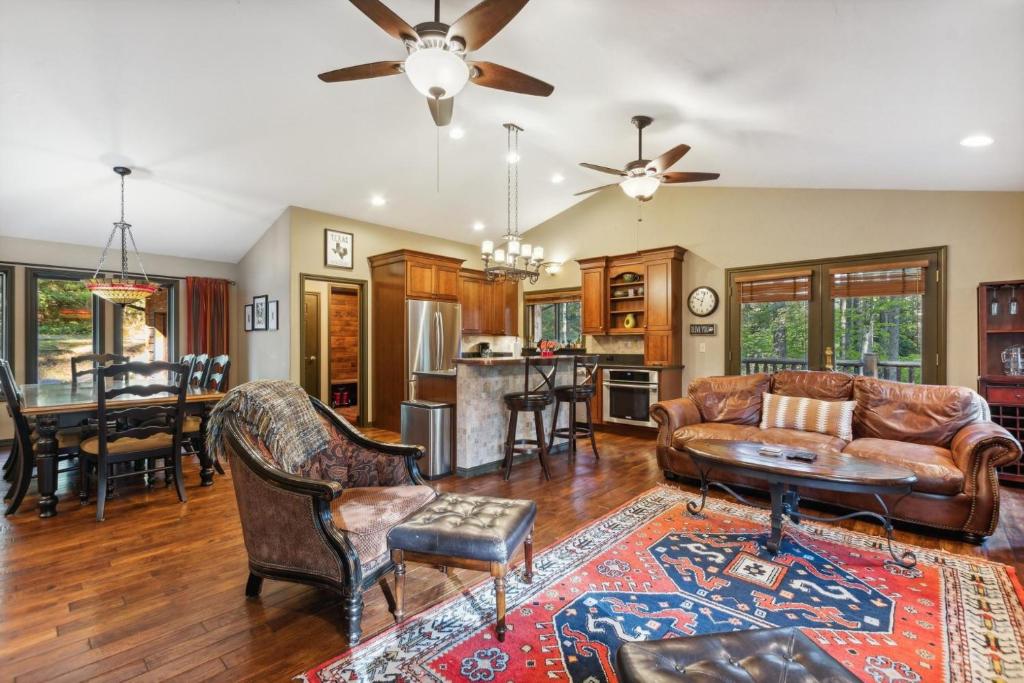 a living room with a couch and a table at Scout's Retreat in Whitefish