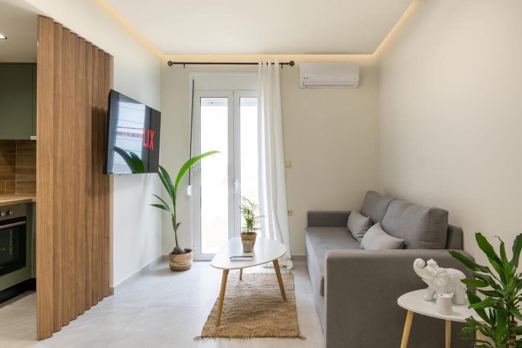 a living room with a couch and a table at S12 Apartments in Heraklio
