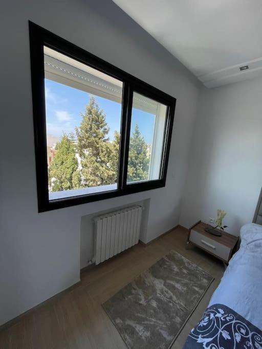 Postel nebo postele na pokoji v ubytování Point central Monastir