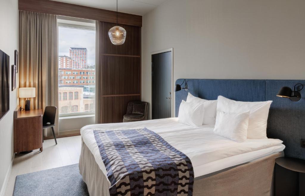 Postel nebo postele na pokoji v ubytování Home Hotel Tapetfabriken