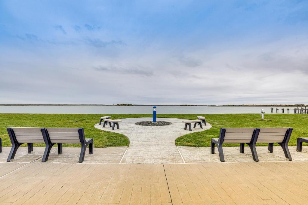 a group of benches in a park near a body of water at Wildwood Crest Apartment, half Mi to the Beach in Wildwood Crest