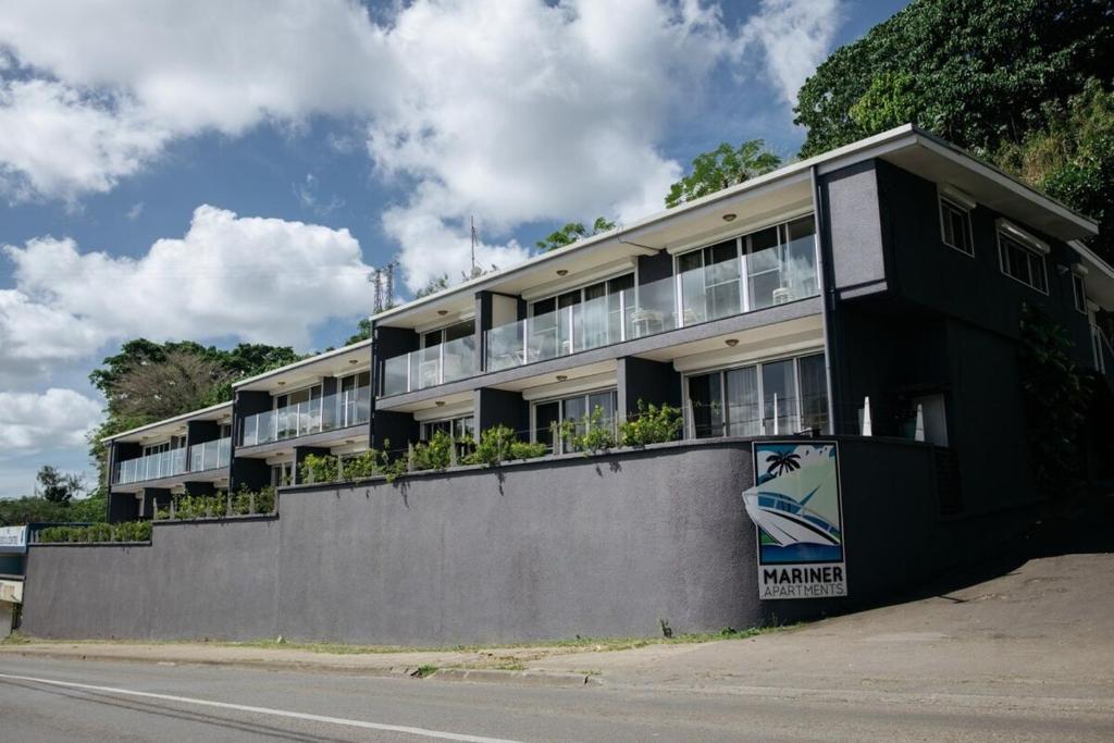 a building on the side of a street at Mariner Apartments in Port Vila