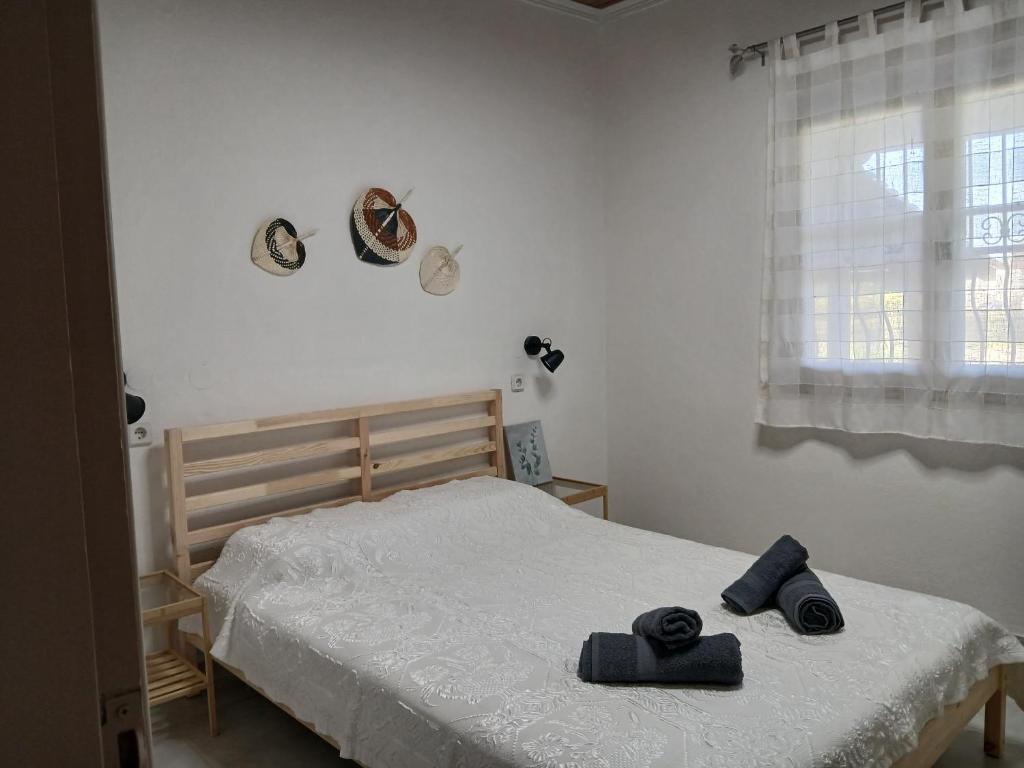 Postel nebo postele na pokoji v ubytování Kanela House