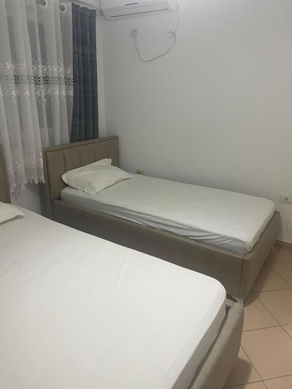 Postel nebo postele na pokoji v ubytování LiXa Home