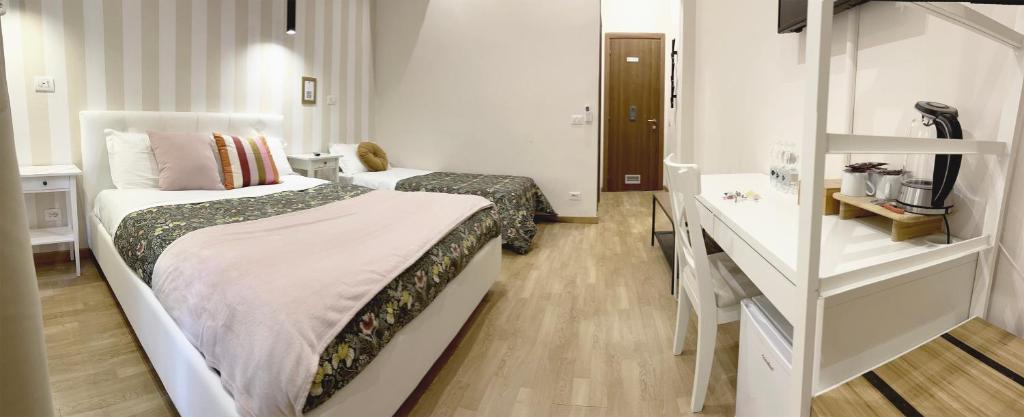 Posteľ alebo postele v izbe v ubytovaní Monti49 GuestHouse