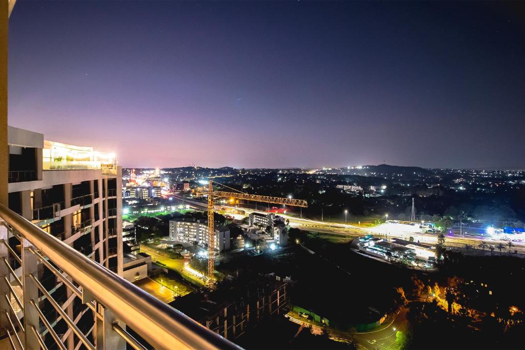 a view of a city at night at 2bedroom apartments at Menlyn Maine on 16th in Pretoria