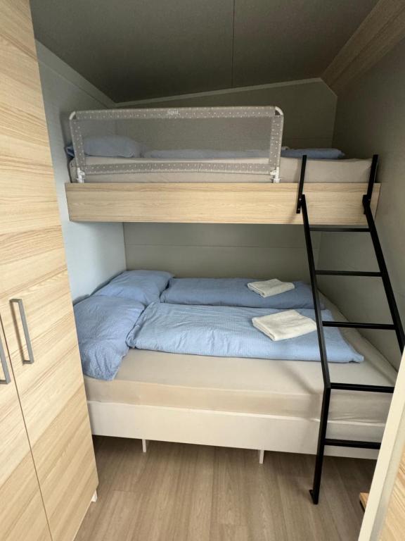 Postel nebo postele na pokoji v ubytování Marty House Drage