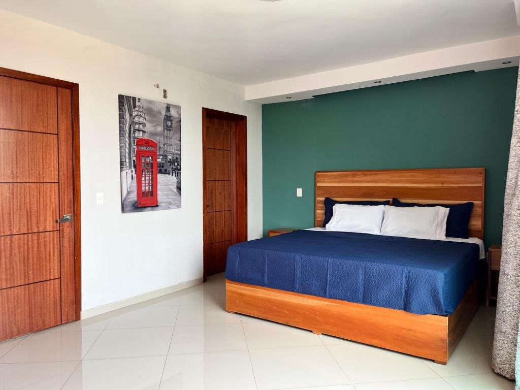 a bedroom with a bed and a red telephone box at Hotel Boutique Blue Diamond in Tepatitlán de Morelos