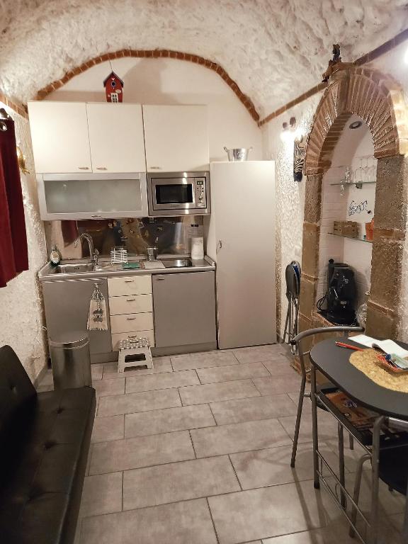 Kuchyňa alebo kuchynka v ubytovaní La Grotta
