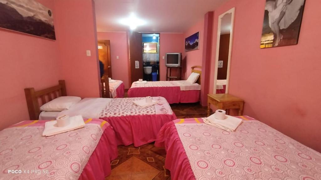 Postel nebo postele na pokoji v ubytování Jaimes Inn Hostel