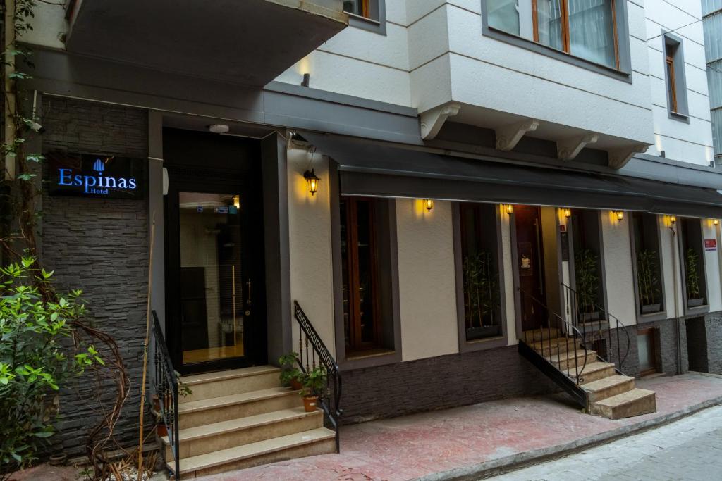 a building with a staircase in front of a building at Espinas Hotel in Istanbul