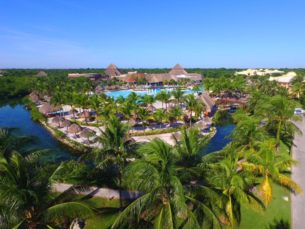 an aerial view of a resort with palm trees at Grand Palladium White Sand Resort & Spa - All Inclusive in Akumal