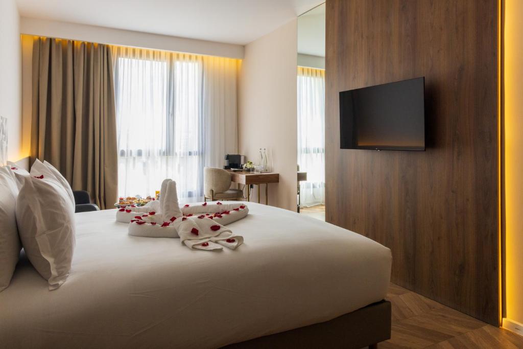 Ένα ή περισσότερα κρεβάτια σε δωμάτιο στο DIAGONAL HOTEL
