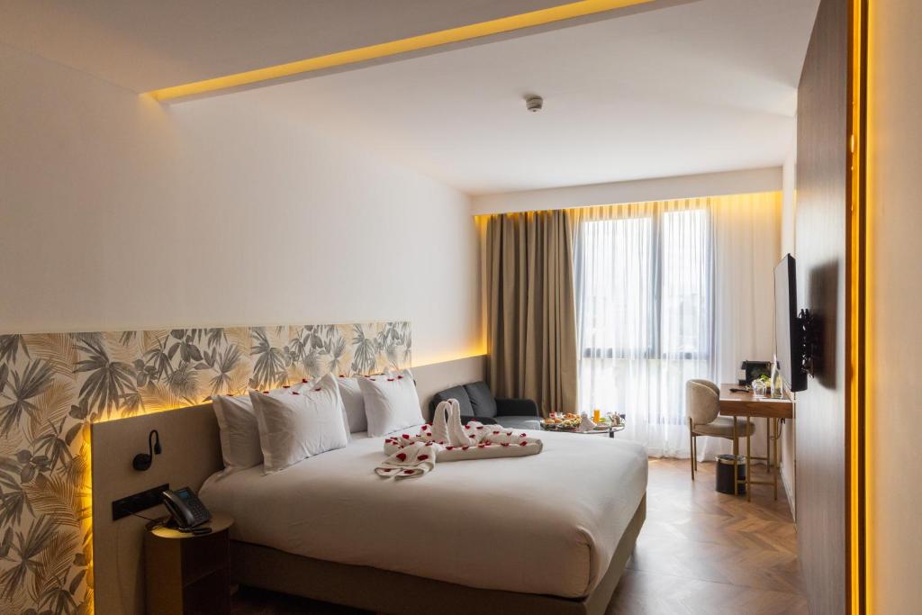 Ένα ή περισσότερα κρεβάτια σε δωμάτιο στο DIAGONAL HOTEL