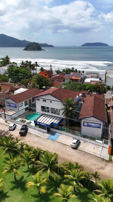 an aerial view of a resort with the ocean at Hotel Venice Ubatuba in Ubatuba