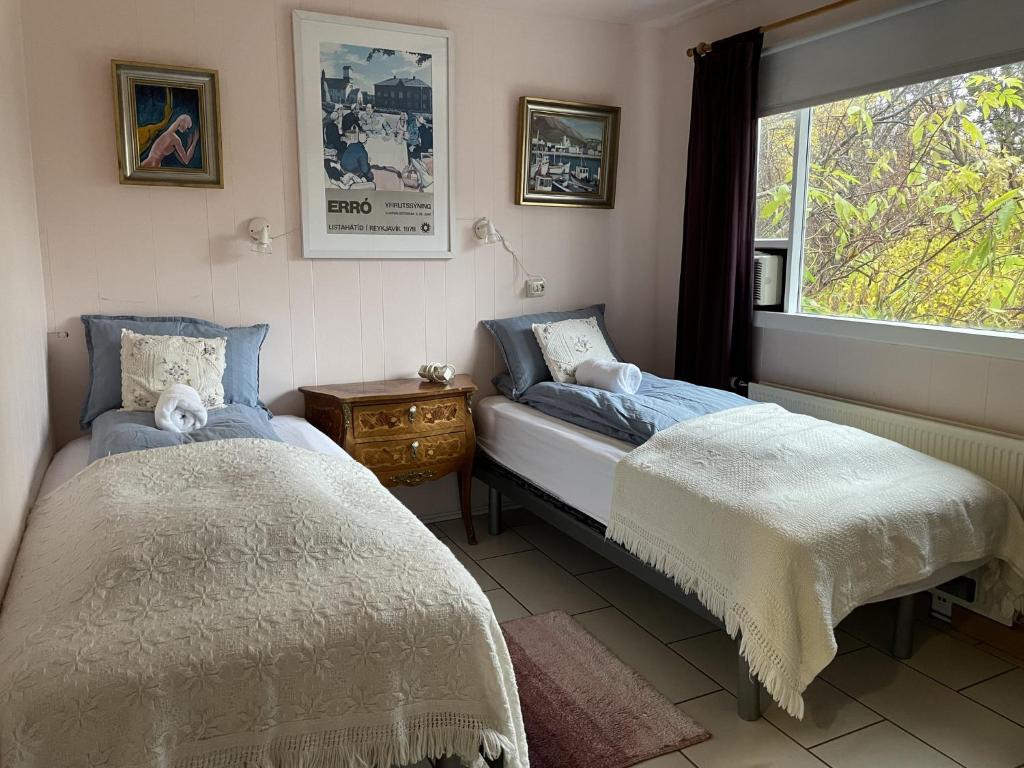Postel nebo postele na pokoji v ubytování Kaldbaks-kot cottages