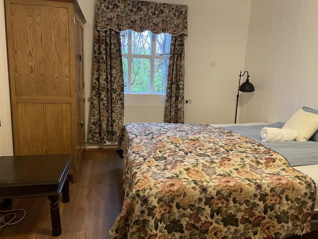 Postel nebo postele na pokoji v ubytování Kaldbaks-kot cottages