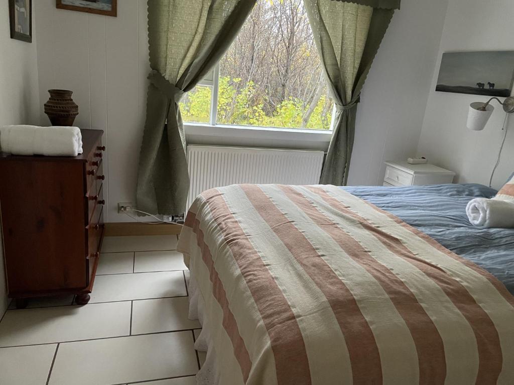 Postel nebo postele na pokoji v ubytování Kaldbaks-kot cottages