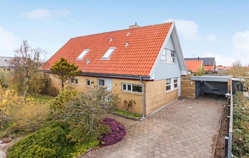 an aerial view of a house with an orange roof at 4 Bedroom Gorgeous Home In Skagen in Skagen
