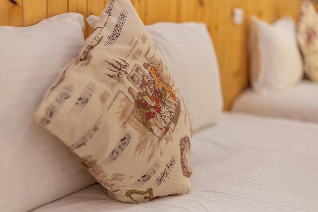 a pillow sitting on top of a bed at Yishin Garden B&amp;B in Pinghe