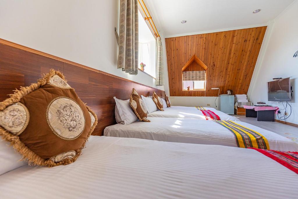 Postel nebo postele na pokoji v ubytování Yishin Garden B&B