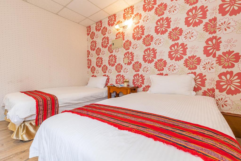Postel nebo postele na pokoji v ubytování Yishin Garden B&B