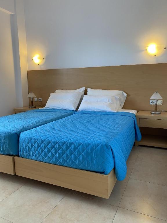 Postel nebo postele na pokoji v ubytování Corafili Holiday Suites