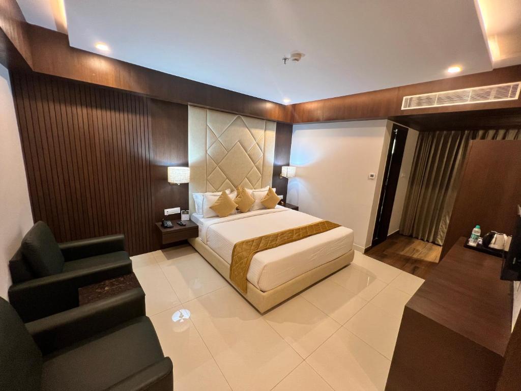 מיטה או מיטות בחדר ב-HOTEL PRAJYOT