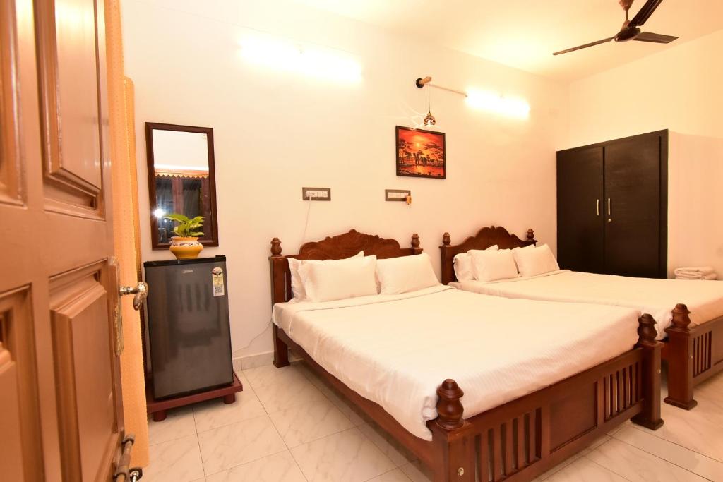 Giường trong phòng chung tại Chez Linda Home Stay