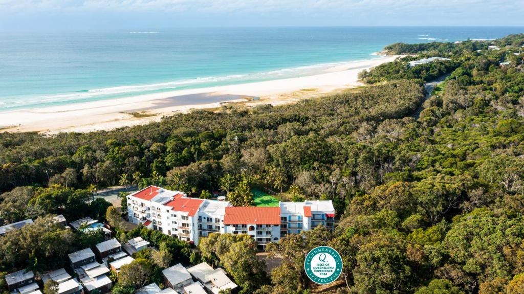 an aerial view of a resort with a beach at The Islander in Point Lookout