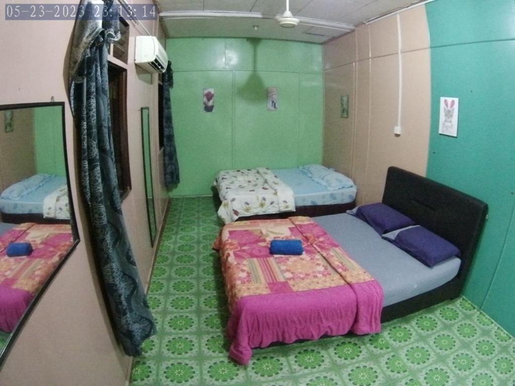 Postel nebo postele na pokoji v ubytování B'first Chalet Perhentian Island