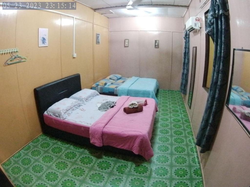 Postel nebo postele na pokoji v ubytování B'first Chalet Perhentian Island