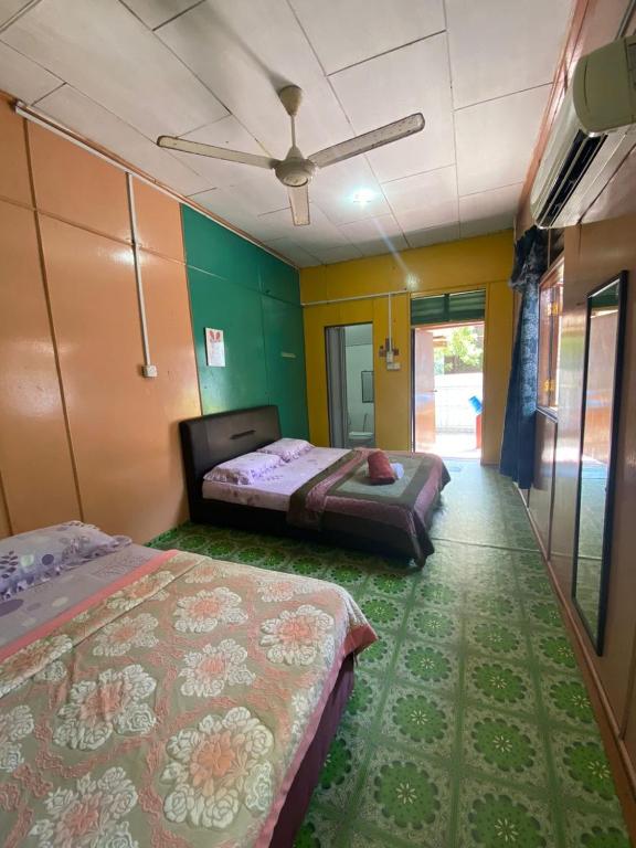 Postel nebo postele na pokoji v ubytování B'first Chalet Perhentian Island