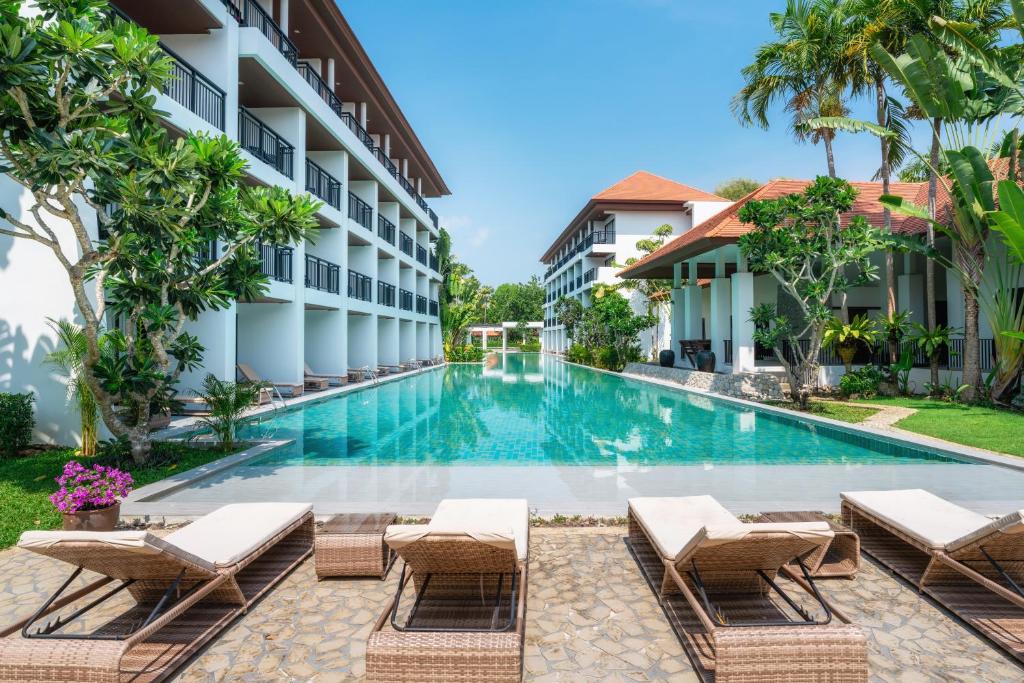 an image of the swimming pool at the resort at D Varee Mai Khao Beach Resort, Thailand in Mai Khao Beach