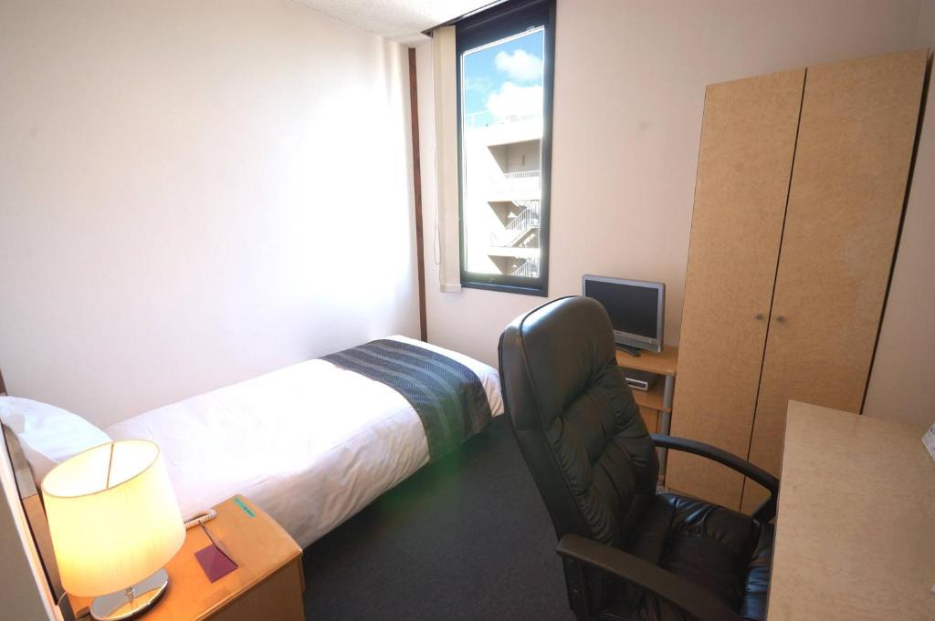Postel nebo postele na pokoji v ubytování ArC LIFESTYLE SPACE & HOTEL