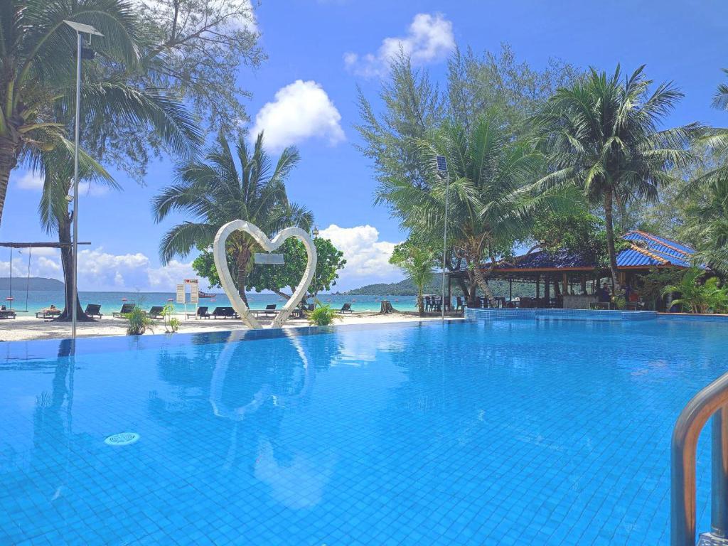 a large swimming pool with a heart in the middle at SCARLET SAILS VILLA in Koh Rong Island