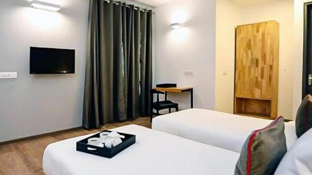 Postel nebo postele na pokoji v ubytování Hotel Wedlock subhash chowk Gurgaon
