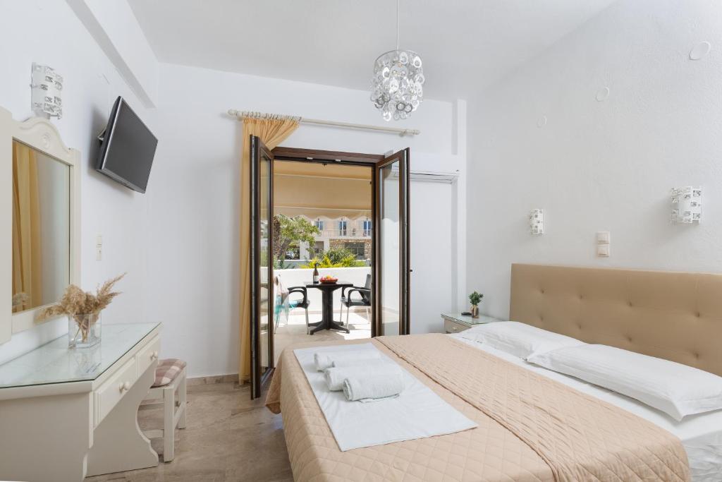 Postel nebo postele na pokoji v ubytování Vassiliki Rooms