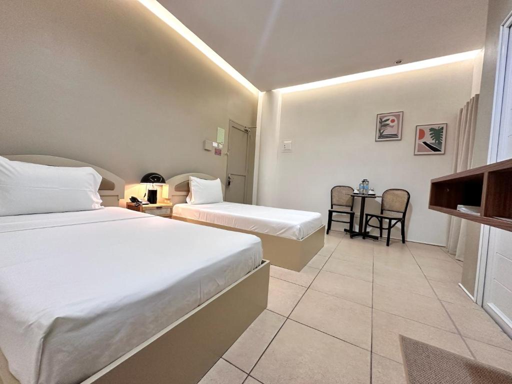 Postel nebo postele na pokoji v ubytování Hotel Nicanor