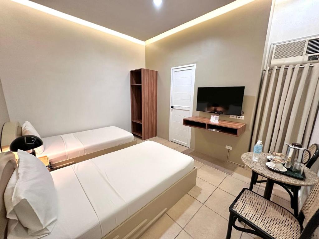 Postel nebo postele na pokoji v ubytování Hotel Nicanor