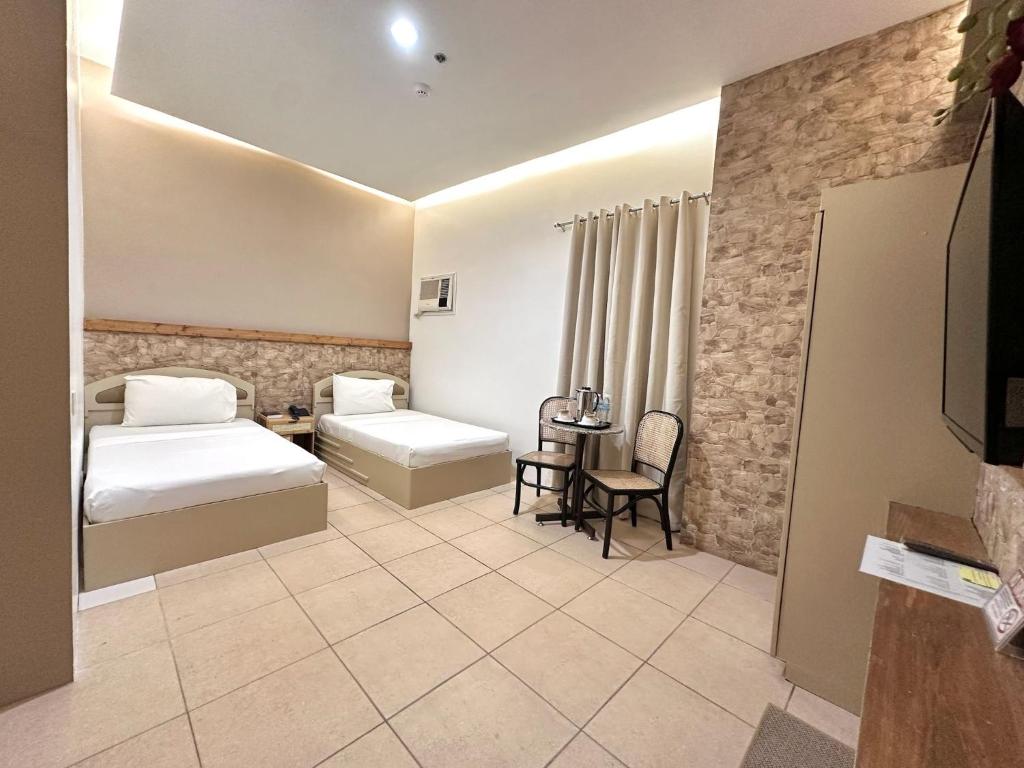Postel nebo postele na pokoji v ubytování Hotel Nicanor