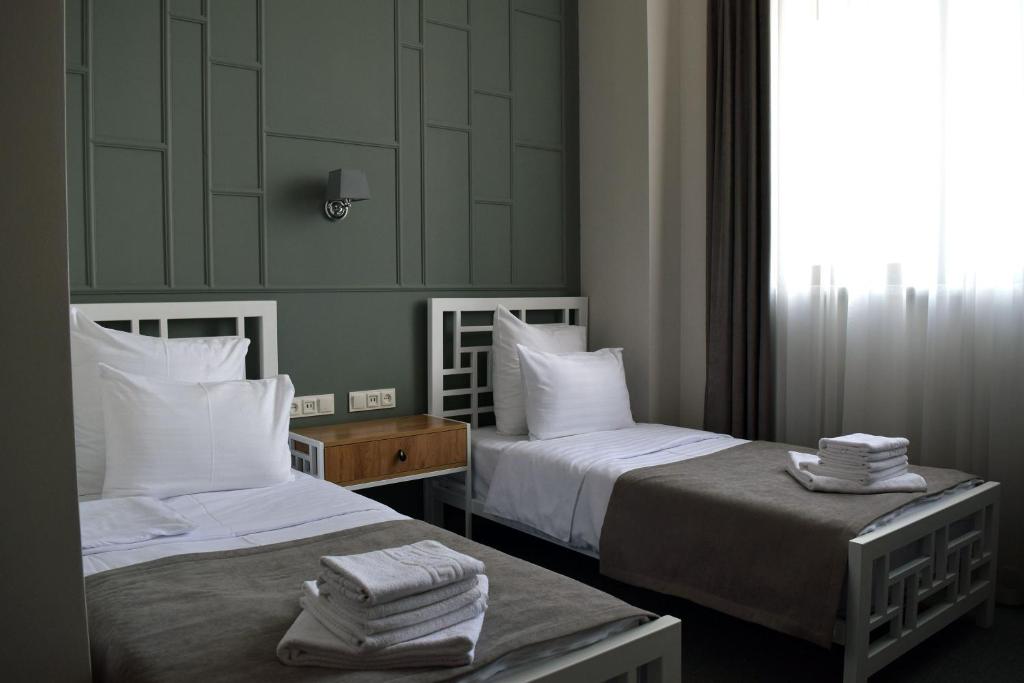 Postel nebo postele na pokoji v ubytování Prime Hotel